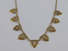 An 18 ct gold French necklace bearing