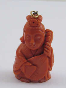 A finely carved Chinese coral pendant 14ea3c