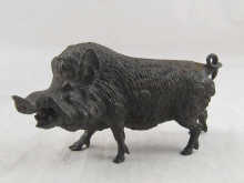 A bronze model of a boar 20 cm long.