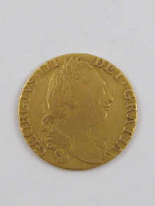 A gold George III guinea coin dated
