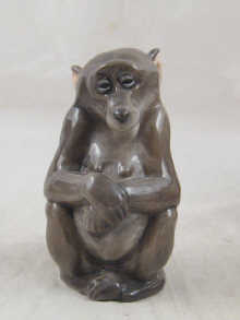 A ceramic Copenhagen model of a monkey