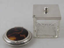 A silver and tortoiseshell powder box