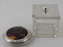 A silver and tortoiseshell powder