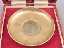 A silver dish the centre set with a