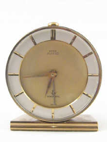 A brass cased Cyma clockwork alarm ht.