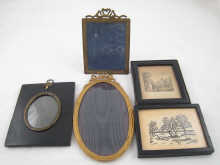 Three wooden two gilt metal frames.