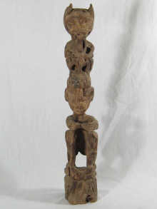 An Indonesian tribal carved wooden figure