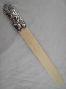 A silver handled ivory page turner