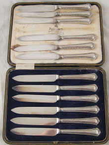 A boxed set of silver handled fruit