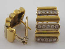 A pair of yellow and white metal 14f01b