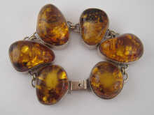 An amber and silver bracelet.