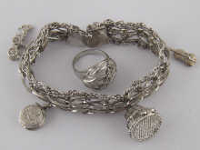 A white metal (tests silver) charm bracelet