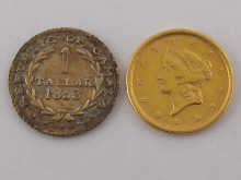 A USA gold one dollar coin dated