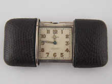 A silver Movado Ermeto purse watch with