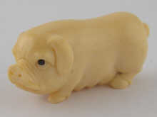 An ivory netsuke of a pig approx.