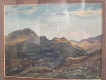 A watercolour of a mountain scene signed