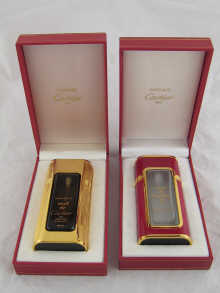 Two perfume bottles by Cartier in original