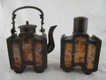 A rectangular decorative teapot and