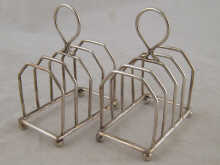 A pair of silver toast racks by