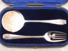 A pair of silver pastry servers