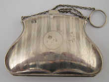 A silver purse with suspensory ring