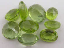 Nine loose polished peridots largest 14f114