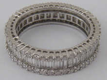 A diamond eternity ring comprising brilliant