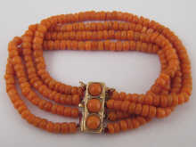A four strand coral bead bracelet