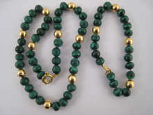 A malachite necklace and bracelet interspaced