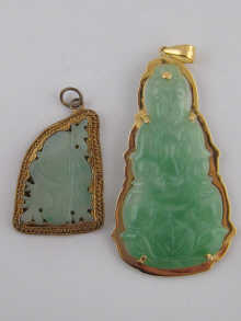 Two Chinese carved jade pendants