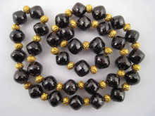 An antique necklace comprising faceted