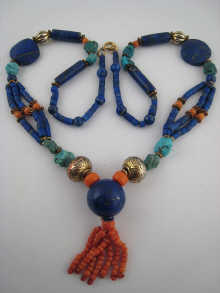A mixed bead pendant necklace including
