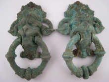 A pair of bronze lion mask and