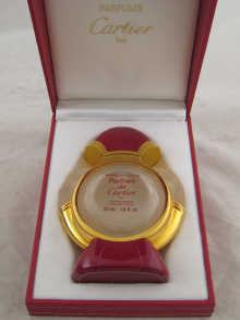 An empty Cartier perfume bottle 14f195