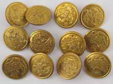 A set of twelve brass buttons with the
