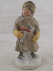 A Soviet Russian figure of a boy