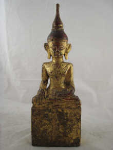 A gilt wooden Buddha provenance;