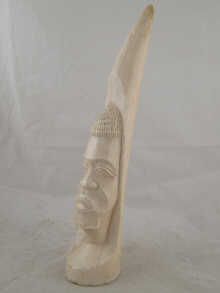 An African ivory tusk carved with