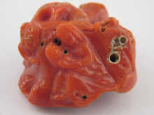 An intricately carved coral depicting 14f1f1