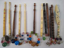 About twelve bone and wood lace bobbins