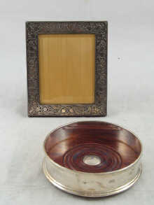 A silver photo frame with bevelled glass