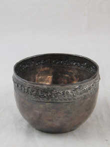 A Persian silver bowl with embossed 14f20c