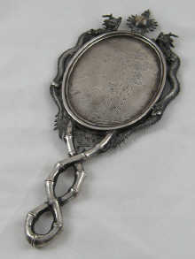 A Chinese silver mirror circa 1880 the