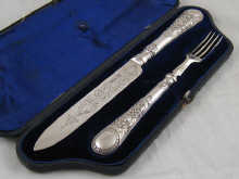 A silver cake knife (approx. 24 cm long)