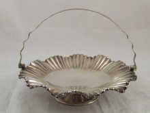 A silver plated fluted swing handle