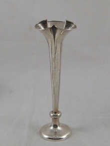 A tall silver specimen vase of trefoil