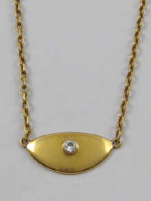 An 18ct gold semi circular pendant 14f27c