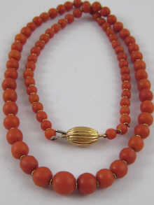 A graduated coral bead necklace