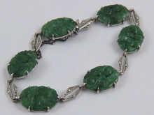 A jade bracelet set in white metal 14f28e