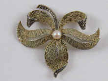 A silver gilt and marcasite floral
